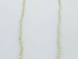 a necklace and earring set with pearls on a white background