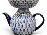 blue and white ceramic teapot with a blue and gold design