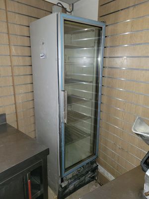 an image of a commercial refrigerator in a kitchen