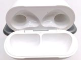 a pair of airpods sitting on top of each other