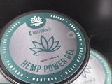 several tins of hemp power bales stacked on top of each other