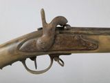 a close up of a rifle with a wooden barrel and a metal handle
