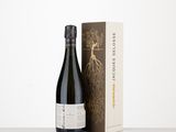 a bottle of wine next to a box on a table
