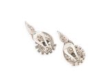 pair of silver earrings on a white background with a white background