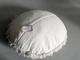 a white pillow with a tag on it