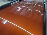 a close up of a car that is being painted