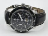 a watch that is sitting on a white surface