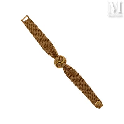 une image représentant un bracelet en or orné d'un nœud