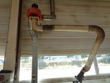 a pipe that is attached to a wall in a garage