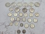 a lot of coins that are on a marble table