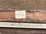 a label on a piece of wood that says leon glazee on it