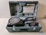 a tool in a case that is sitting on a table