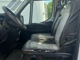 a white van with a black seat in the back of it