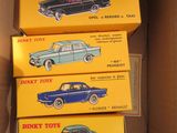 three boxes of toy cars are stacked on top of each other in a cardboard box