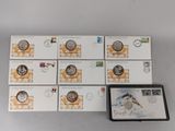 six stamps and a box of stamps with a picture of a bird on them