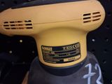 a sander sitting on top of a table in a store
