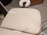 a chair that has a pillow on top of it