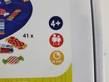 a box with a picture of a child playing with toys