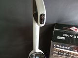 a vacuum that is sitting on a table next to a box