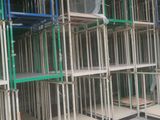 many shelves that are stacked up in a room