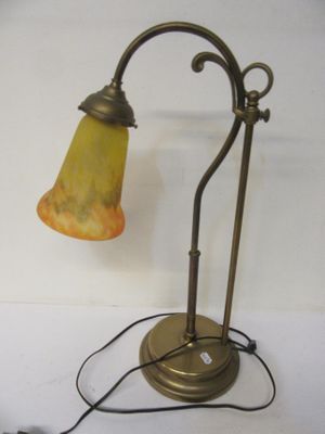a lamp that is sitting on a table next to a wall