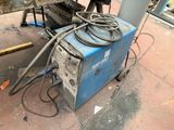 a machine that is sitting on the ground next to a table