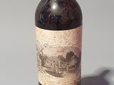 a bottle of wine that is sitting on a table