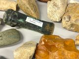 many rocks and stones that are on a table