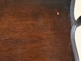 a wooden tray that has a handle on it