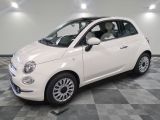 la photo d'une petite voiture blanche garée dans un garage