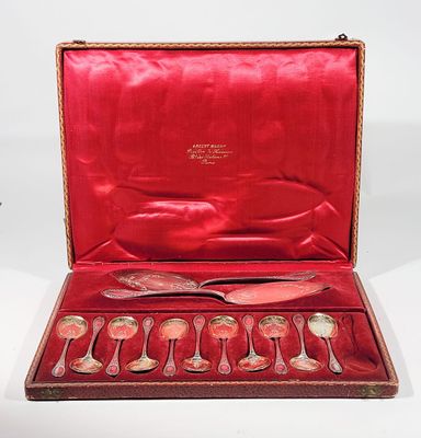 a red case with silverware in it on a white surface