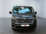 the front view of a black van parked in a showroom