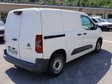 a white van that is parked in a parking lot