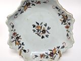 a white plate with a floral design on it