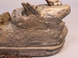 a statue of a dog with a chain around its neck