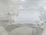 a piece of plastic on the floor of a building