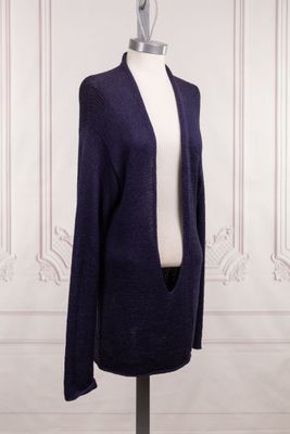 a close up of a mannequin mannequin wearing a purple cardigan