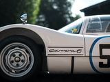 a close up of a white race car with a number 53 on the side