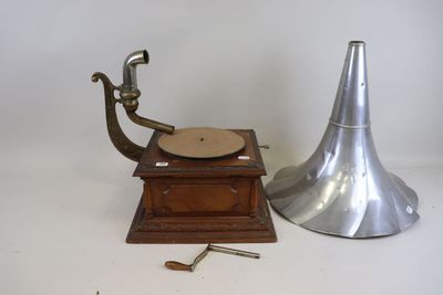 a small metal object next to a small metal object on a white surface