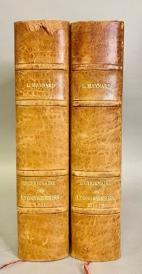 an old pair of books sitting on top of each other