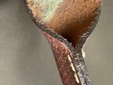 the inside of a handbag with a leather handle and a zipper