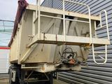 an image of a dump truck parked in front of a building