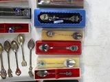 many different types of spoons and spoon knives in a display case
