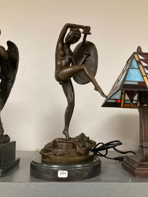 three lamps that are sitting on a shelf next to each other