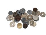 a pile of old coins on a white surface