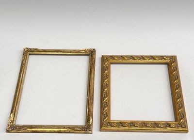 two gold picture frames on a white background