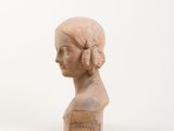 marble bust of a woman ' s head on a white background