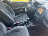 the interior of a small car with black seats and a steering wheel