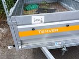a close up of a trailer with a cage on the back
