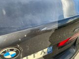 a bmw logo on the back of a black car